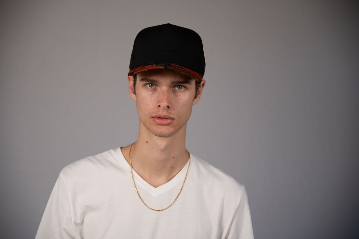 5-Panel Snapback (Curved Bill) — Black / Orange Camo Bill — Dozen Pack
